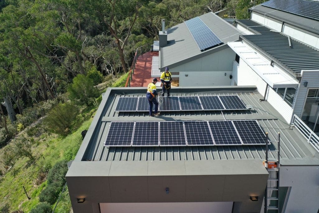 Class A Energy Solutions installation crew installing residential solar panels on a home.